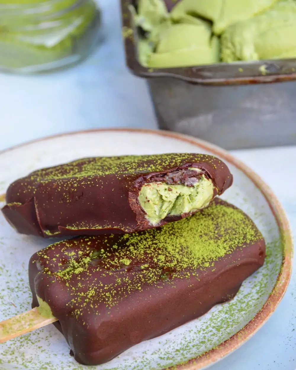 https://www.fuelednaturally.net/ezoimgfmt/uploads-ssl.webflow.com/625aff85c051395e6f8d5f8b/628cba26b5f08a800c6fd956_VEGAN-MATCHA-CHOCOLATE-ICE-CREAM-BARS.jpg?ezimgfmt=ng:webp/ngcb1